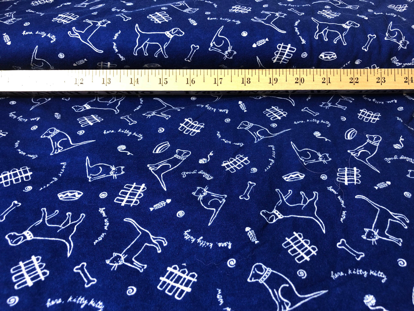 Royal blue knit with dogs and cats print 55" wide 2 3/4 yards