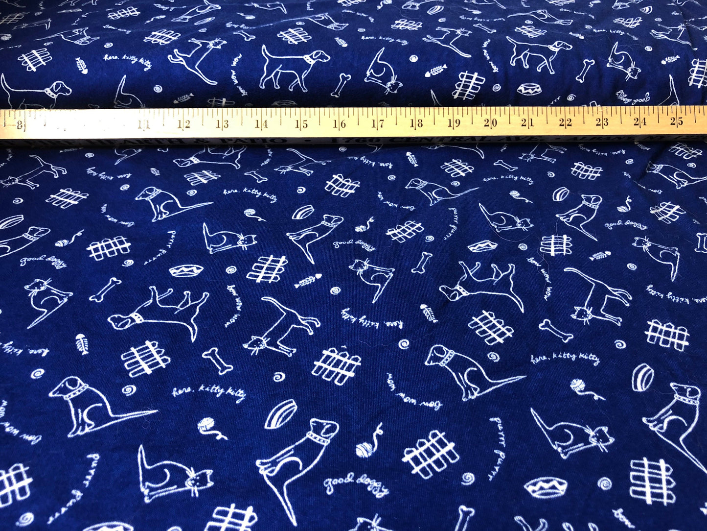Royal blue knit with dogs and cats print 55" wide 2 3/4 yards